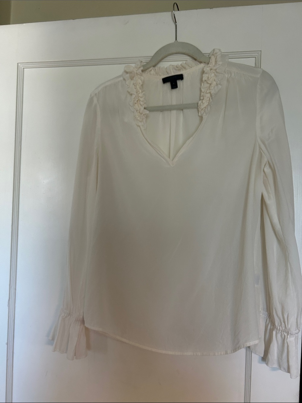 J. Crew. Ruffled neck in front and back blouse.